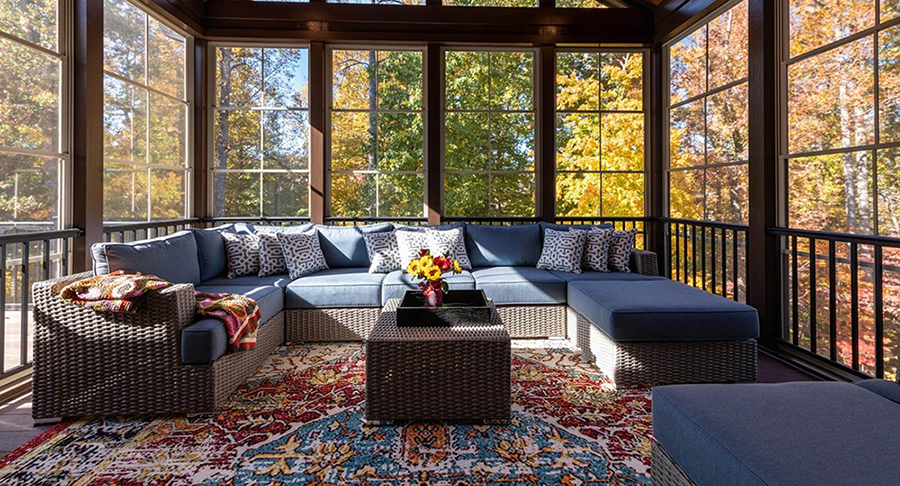 This sunroom offers a perfect sanctuary to enjoy the beauty of autumn from the comfort of home